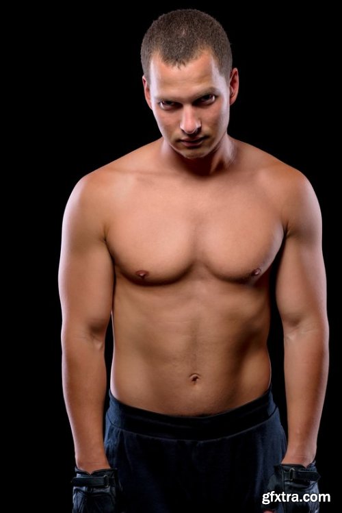 Vertical portrait of an athlete on dark background