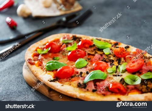 Fresh pizzas with tomatoes, cheese and mushrooms on wooden table closeup - Stock Photos