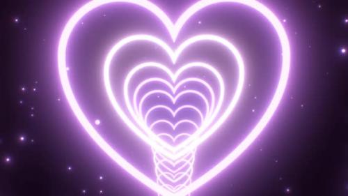 Videohive - Fly Through Purple Heart Shaped Neon Light Glow Circular Ring Tunnel - 4K - 36997546 - 36997546