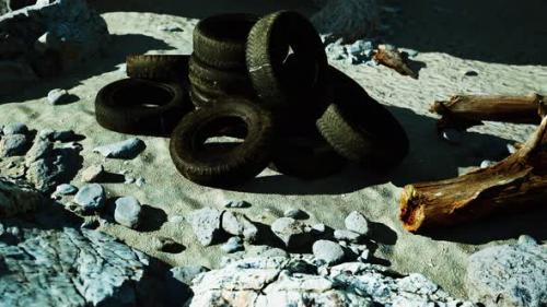 Videohive - Old Tires Overgrown Embedded in the Sand - 37096216 - 37096216