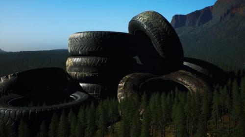 Videohive - Concept of Environmental Pollution with Big Old Tires in Mountain Forest - 37087153 - 37087153