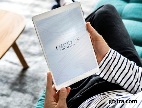 Man using a tablet with a screen mockup 