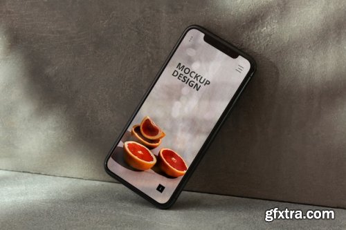 Phone on concrete wall Mockup