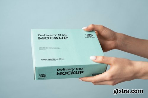 Hand holding delivery pack mockup
