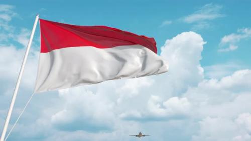 Videohive - Commercial Airplane Landing Behind the Indonesian Flag - 38313362 - 38313362