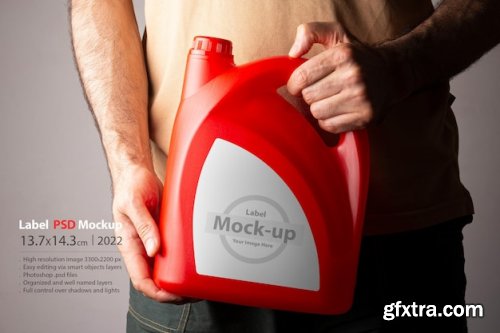 A man holding a red kitchen detergent bottle mockup