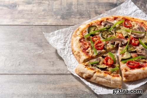 Vegetarian pizza with zucchini tomato peppers and mushrooms 