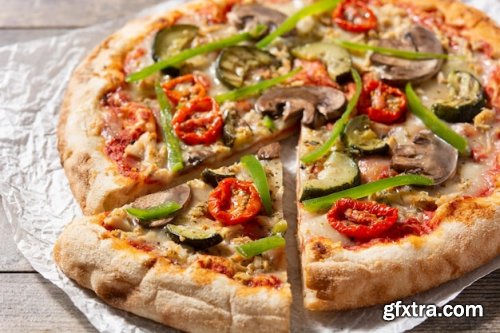 Vegetarian pizza with zucchini tomato peppers and mushrooms 