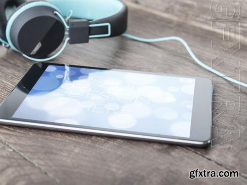 Tablet on Table with Headphones Mockup 215881968