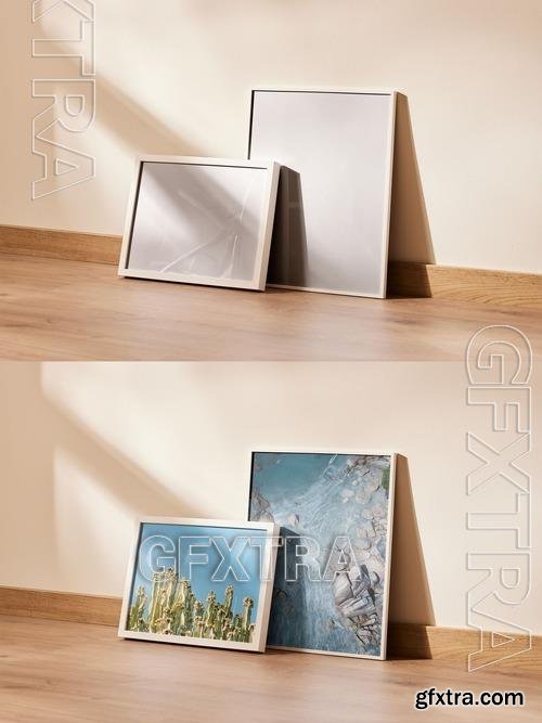 Group of Two Picture Frames Lean on a Wall 535855096