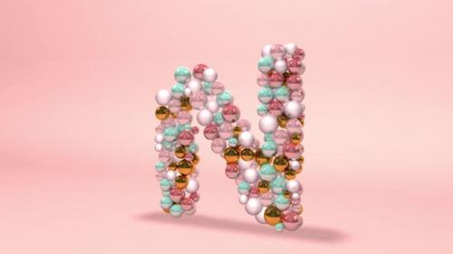 Videohive - Letter N made of beads, glass balls, pastel pearls, crystal jewels and gold. 3d Abstract animation o - 42660211 - 42660211