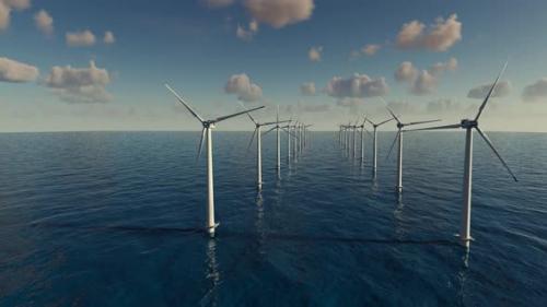 Videohive - Large wind turbines generating electricity on the sea of a beautiful sunset and clouds. - 43220444 - 43220444