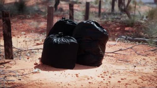 Videohive - Closeup of Full Trash Bags on the Sand - 43426495 - 43426495