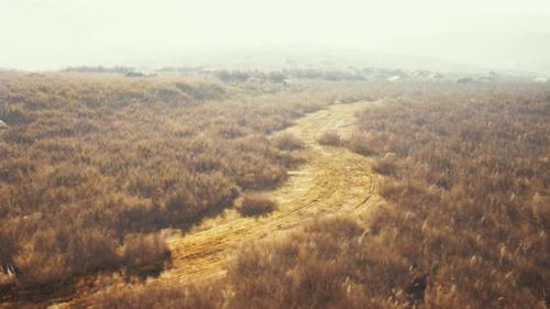 Videohive - Aweinspiring Shot of a Rocky Terrain with Grass and Fog - 47592493 - 47592493