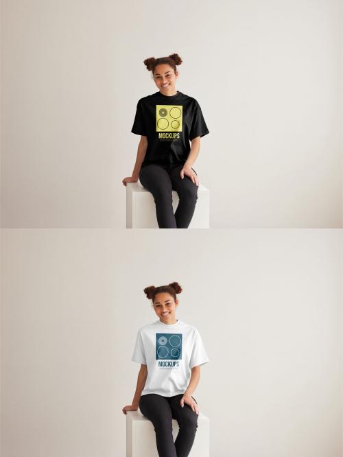 Mockup of woman wearing t-shirt with customizable color sitting on plinth 637253544