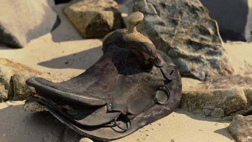 Videohive - Very Old Horse Saddle on Sand Beach - 47639760 - 47639760
