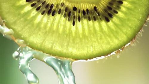 Videohive - Super Slow Motion Macro Shot of Flowing Water From Kiwi Slice at 1000Fps - 47752277 - 47752277