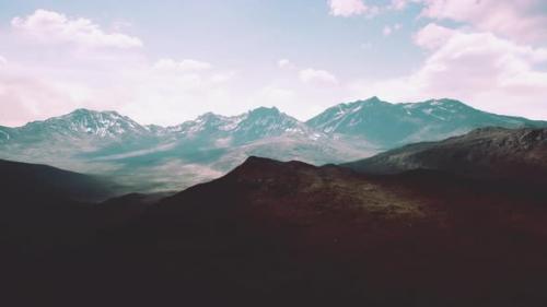 Videohive - Aerial Over Valley With Snow Capped Mountains In Distance - 47787841 - 47787841