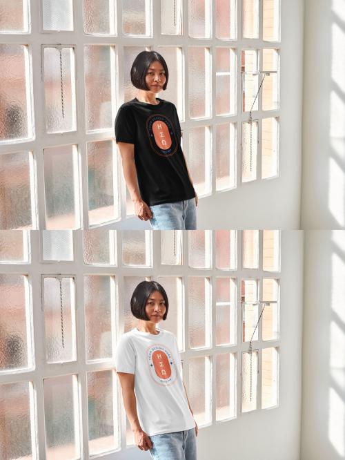 Mockup of Asian woman wearing t-shirt with customizable color leaning against window 640126835