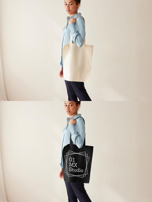 Mockup of woman wearing customizable tote bag over shoulder 640119982