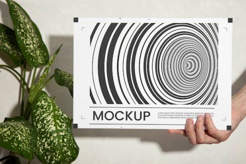 Premium PSD | Hand holding optical print mockup Premium PSD