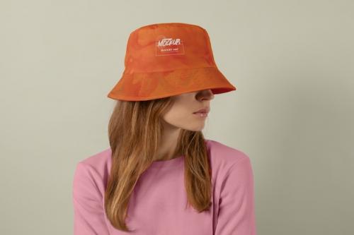 Premium PSD | Front view woman posing with bucket hat Premium PSD