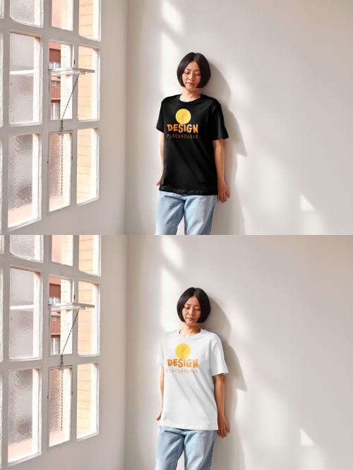 Mockup of Asian woman wearing customizable color t-shirt leaning against wall 649153890