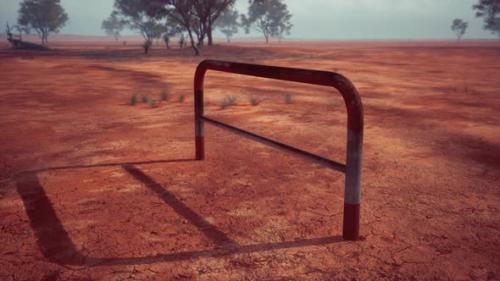 Videohive - A Rustic Red Dirt Field with a Charming Fence and Trees in the Background - 48093901 - 48093901