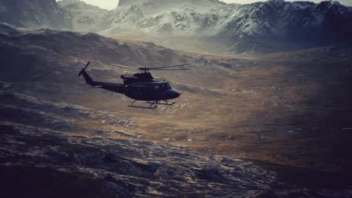 Videohive - Slow Motion Vietnam War Era Helicopter in Mountains - 48098372 - 48098372