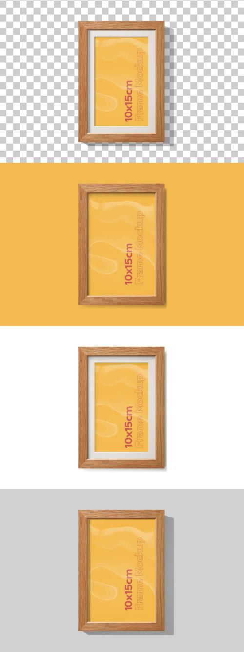 Mockup of vertical oak wood frame 10 x 15 cm with customizable background, mount and shadows 646711281