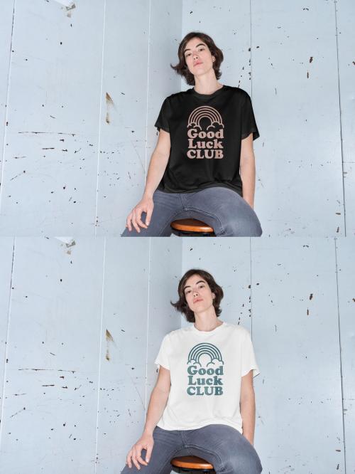 Mockup of woman wearing customizable color t-shirt sitting on stool by wall, flash on camera 646704427