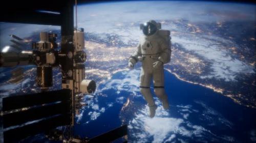 Videohive - International Space Station and Astronaut in Outer Space Over the Planet Earth - 48098241 - 48098241