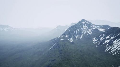 Videohive - Awesome Top View Through Clouds to High Snowy Mountains - 48099738 - 48099738