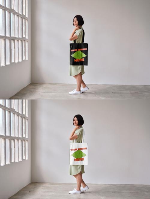 Mockup of Asian woman holding customizable tote bag, side view full length 644106568