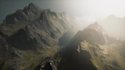 Videohive - A Breathtaking Aerial View of Majestic Sunlit Mountain Peaks - 48388256 - 48388256