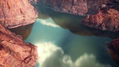 Videohive - A Serene Mountain Lake Reflecting the Surrounding Peaks - 48388323 - 48388323