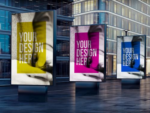 3 Outdoor Kiosk Advertising Mockups on City Street at Night - 182614021