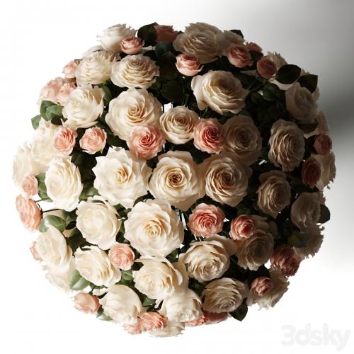 Bouquet of white and pink roses in a glass classic vase