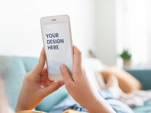 Person Using Mobile Phone on Couch Mockup - 259162364