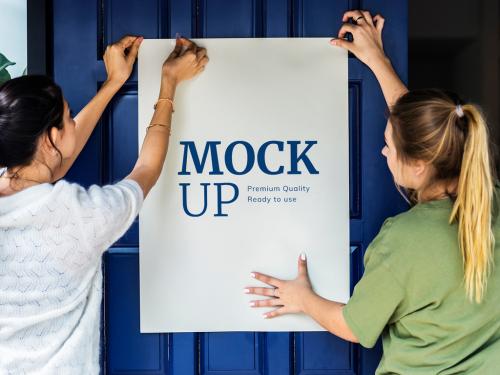 2 People Putting Up a Poster Mockup - 261383334