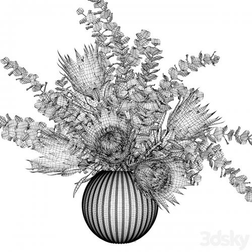 Bouquet with white proteas and eucalyptus in a ribbed glass vase