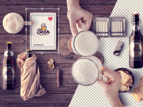 2 Toasting Mugs at a Table with Beer Bottles and Devices Mockup - 319878482