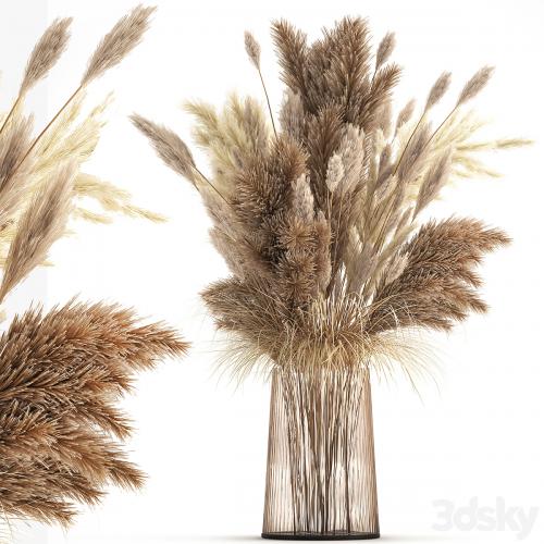 Beautiful lush bouquet of dried flowers in a vase with dry branches of pampas, Cortaderia, white reeds. 146.