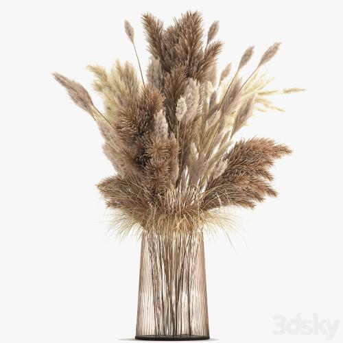 Beautiful lush bouquet of dried flowers in a vase with dry branches of pampas, Cortaderia, white reeds. 146.