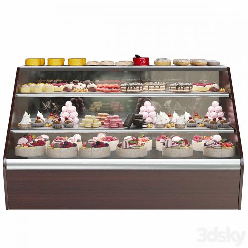 Confectionery. Refrigerator with sweets and desserts. Cake