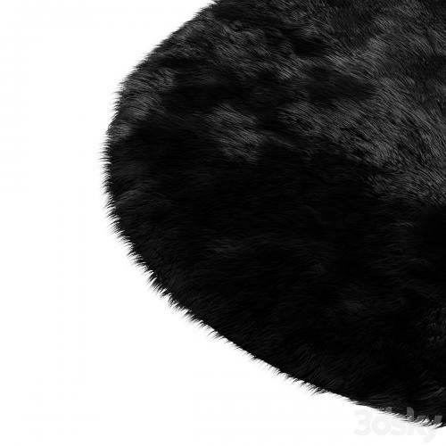 Round fluffy black carpet