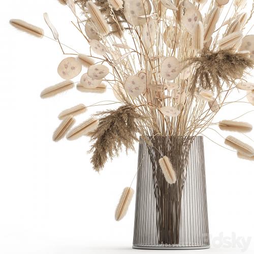 A beautiful bouquet of dried flowers in a vase with dry branches of pampas, reeds, lunnik. 127.