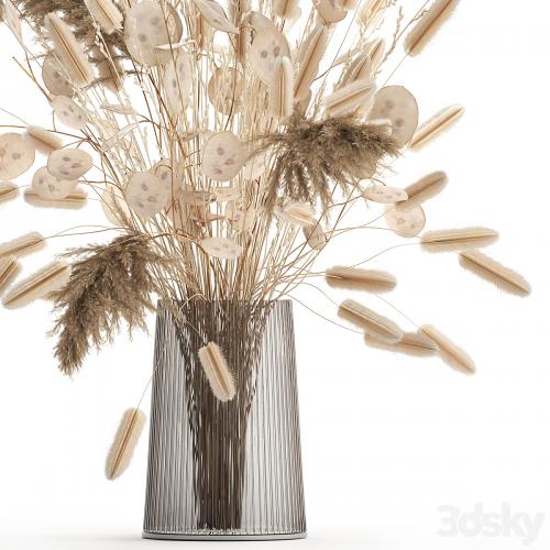 A beautiful bouquet of dried flowers in a vase with dry branches of pampas, reeds, lunnik. 127.