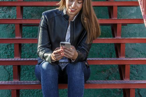 Deeezy - Smiling student using laptop - 20 Stock Photos