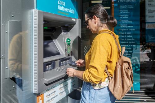 Deeezy - Woman at an ATM machine - 5 stock photos